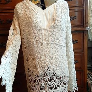 Creamy white long sleeve lace dress.